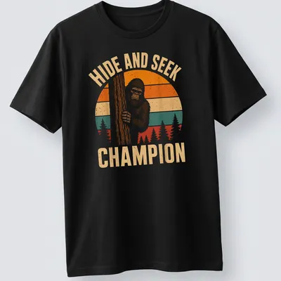 Retro vintage Bigfoot Sasquatch t-shirt with playful text above cartoon art