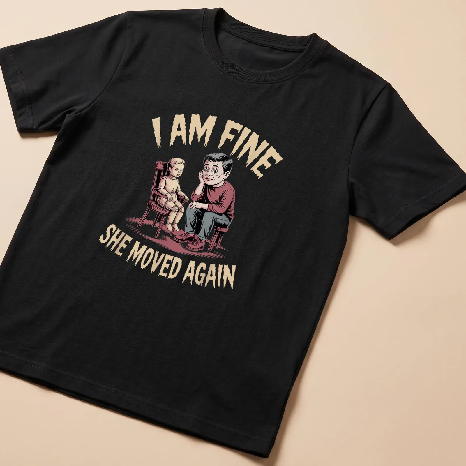 Humorous illustration of a father with a doll and text saying I AM FINE SHE MOVED AGAIN — printed on a unisex t-shirt