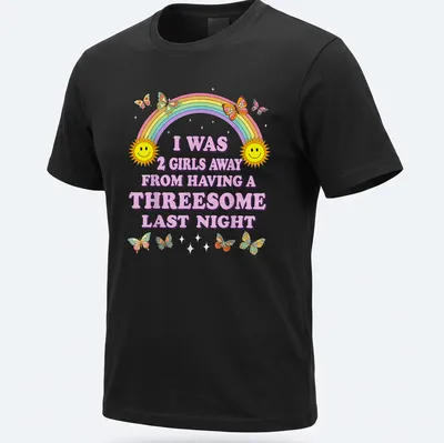 Colorful cartoon shirt with smiling suns, butterflies, and humorous text