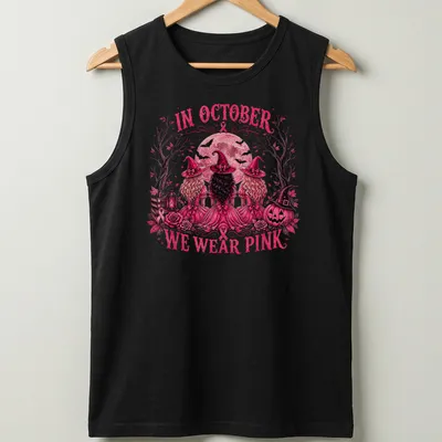 Vintage illustration of three witches with the text 'In October We Wear Pink' — printed on a tank top