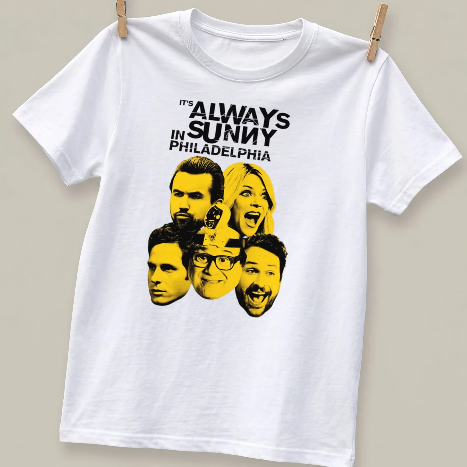 Bold graphic tee featuring the cast of It's Always Sunny In Philadelphia in yellow and black — printed on a unisex t-shirt