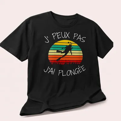 Retro design featuring scuba diver text in orange, green, yellow, red, and white colors — printed on a unisex t-shirt (angled view)