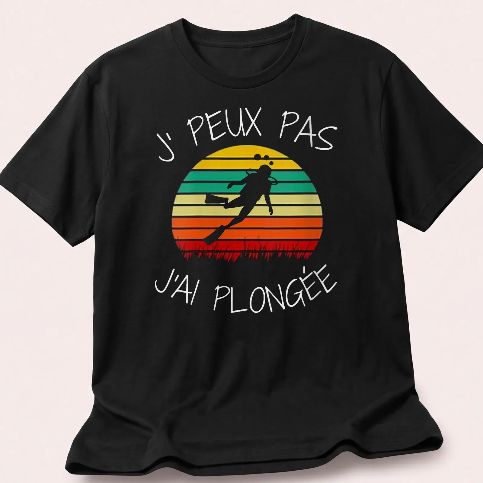 Retro design featuring scuba diver text in orange, green, yellow, red, and white colors — printed on a unisex t-shirt