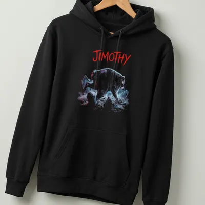 Illustrative t-shirt featuring a raccoon bursting from a grave with colorful text beneath — printed on a unisex hoodie