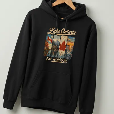 Vintage T-shirt featuring Canadian flag, cabin by lake, and maple leaf — printed on a unisex hoodie