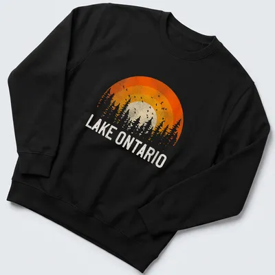 Sunset over trees with Lake Ontario text in vintage retro style — printed on a unisex sweatshirt