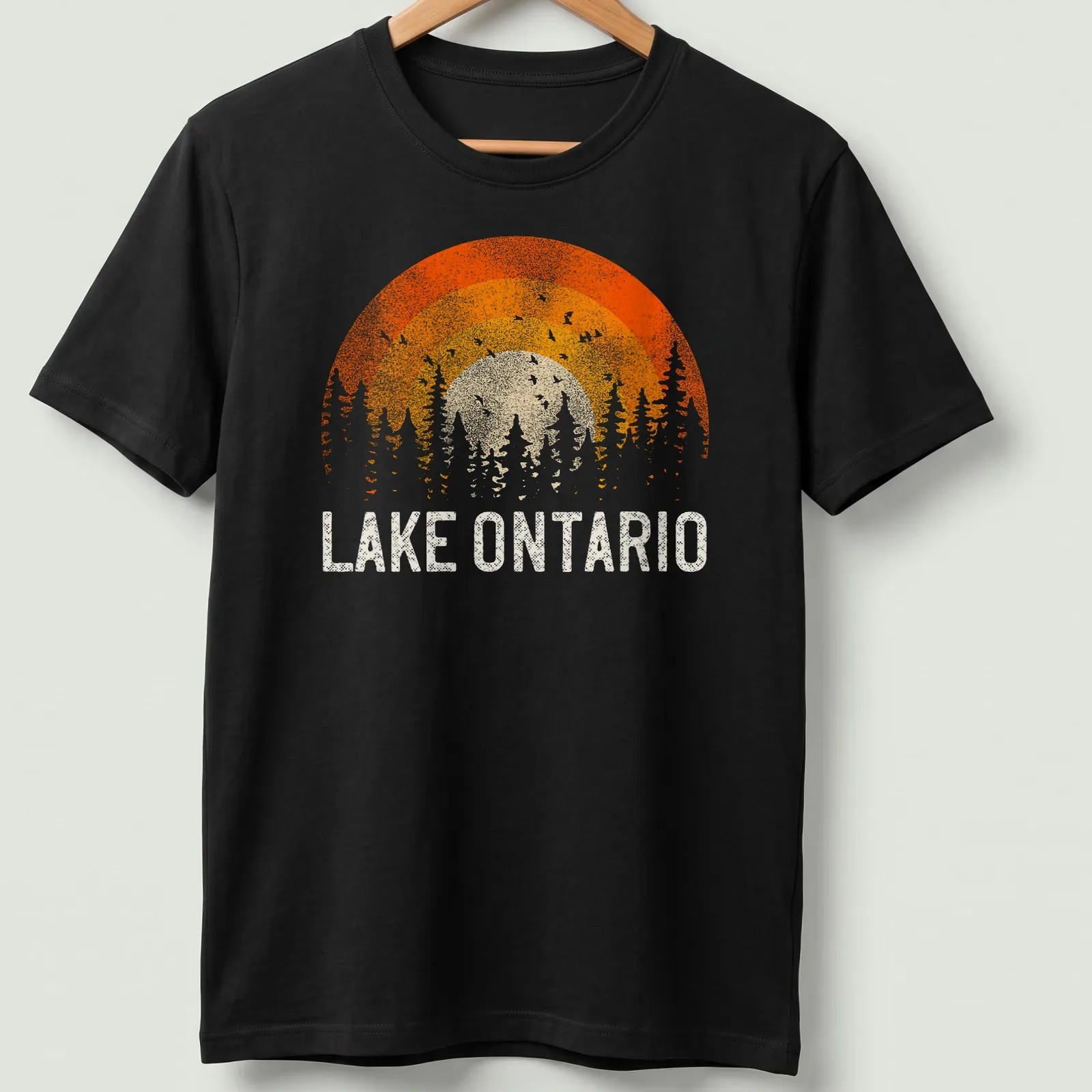 Sunset over trees with Lake Ontario text in vintage retro style — printed on a unisex t-shirt