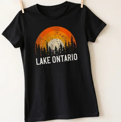 Sunset over trees with Lake Ontario text in vintage retro style — printed on a women's shirt