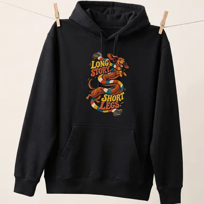 Colorful cartoon Dachshund with text 'LONG STORY. SHORT LEGS.' — printed on a unisex hoodie