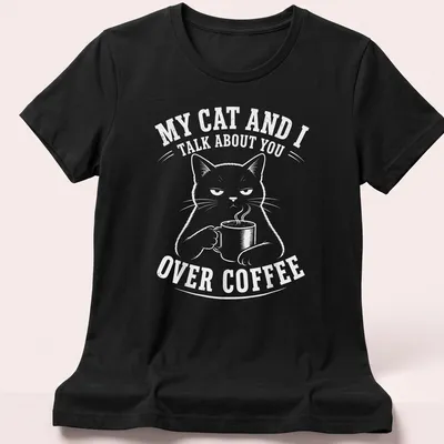 Humorous black cat t-shirt featuring a meme about coffee conversations — printed on a women's shirt