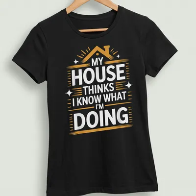 Bold text t-shirt with the phrase 'My House Thinks I Know What I'm Doing' in white, orange, and gold — printed on a women's shirt