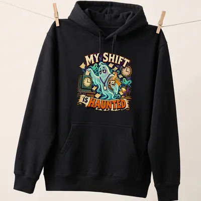 Cartoon ghost graphic above text 'My Shift Is Haunted' in bold colors — printed on a unisex hoodie