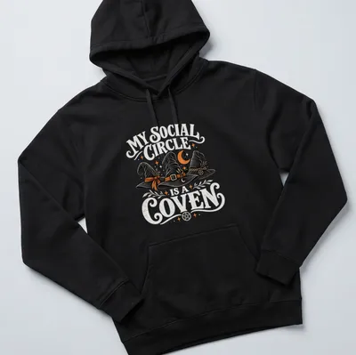 Whimsical design featuring witch hats with the text My Social Circle Is A Coven — printed on a unisex hoodie