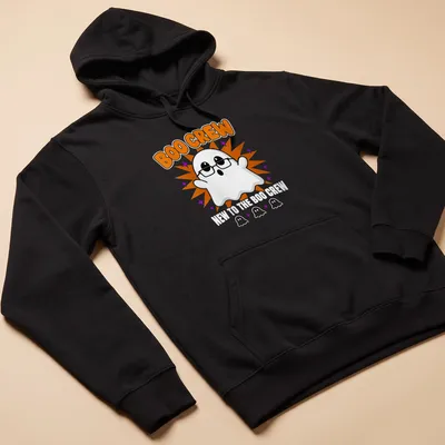 Cartoon ghost graphic with text 'New To The Boo Crew' in orange and purple — printed on a unisex hoodie