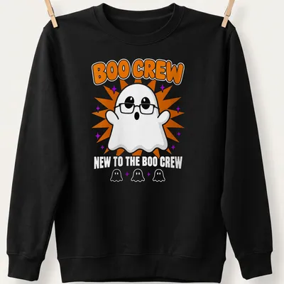 Cartoon ghost graphic with text 'New To The Boo Crew' in orange and purple — printed on a unisex sweatshirt