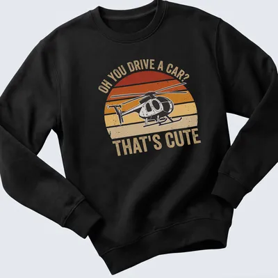 Retro distressed T-shirt with sarcastic text and helicopter graphic in orange and cream — printed on a unisex sweatshirt