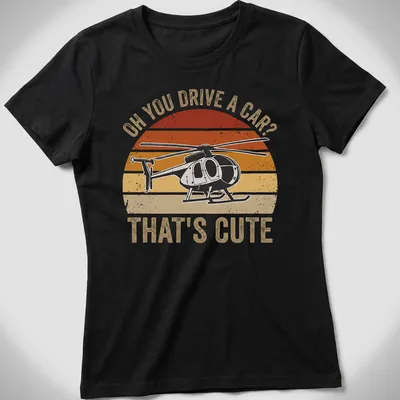 Retro distressed T-shirt with sarcastic text and helicopter graphic in orange and cream — printed on a women's shirt