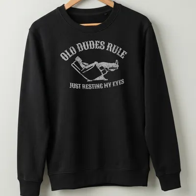 Vintage distressed t-shirt with a reclining man and humorous text about resting eyes — printed on a unisex sweatshirt