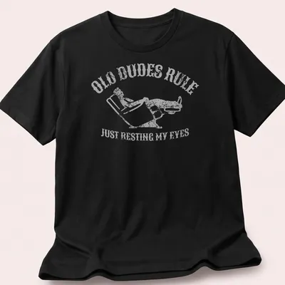 Vintage distressed t-shirt with a reclining man and humorous text about resting eyes — printed on a unisex t-shirt