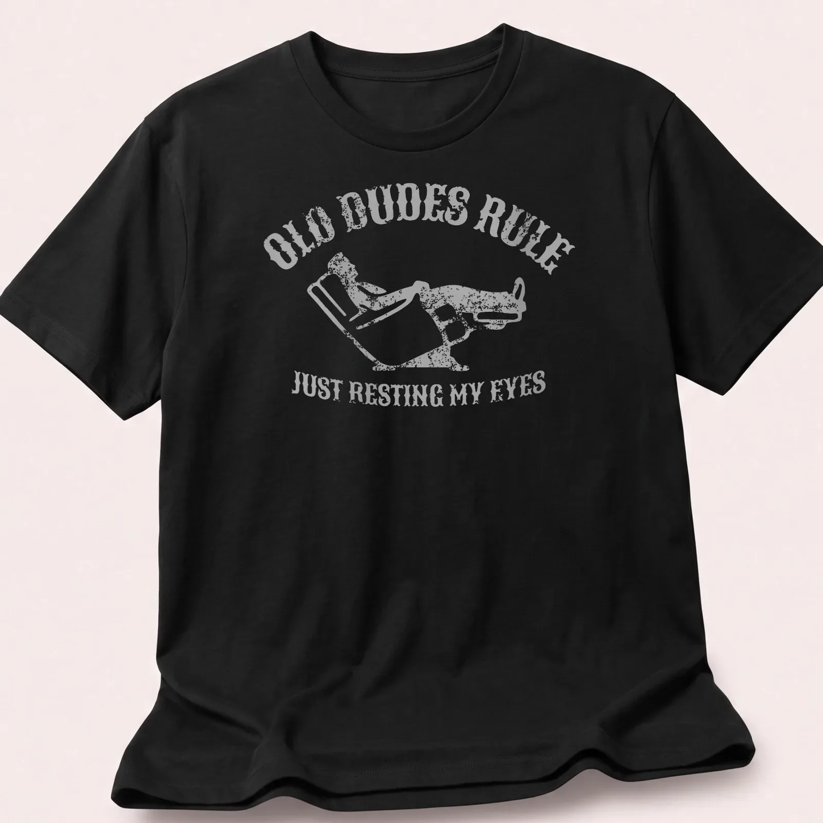 Vintage distressed t-shirt with a reclining man and humorous text about resting eyes — printed on a unisex t-shirt