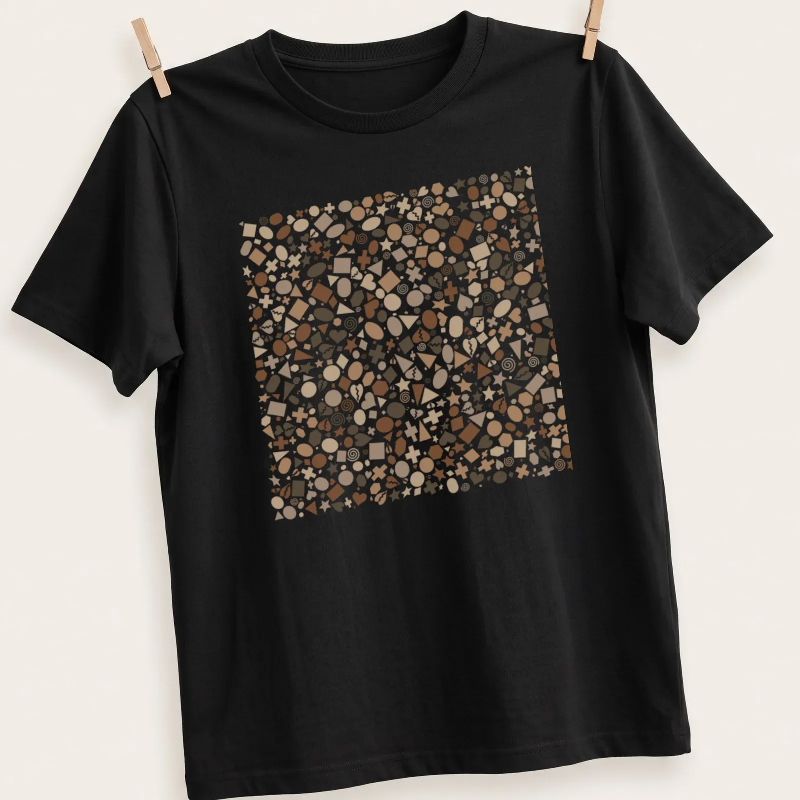 Playful geometric shapes in earthy colors of brown, beige, and white. — printed on a unisex t-shirt