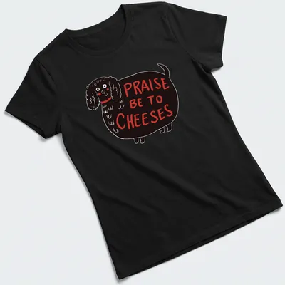 Whimsical illustration of a black dog with the text 'Praise Be To Cheeses' — printed on a women's shirt