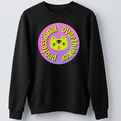Colorful cartoon cat with a third eye and the text 'Professional Overthinker' — printed on a unisex sweatshirt