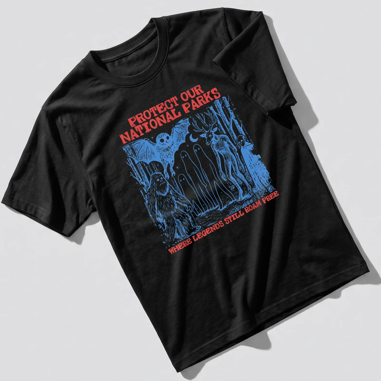 Vintage illustration of Bigfoot, aliens, and text about protecting national parks. — printed on a unisex t-shirt