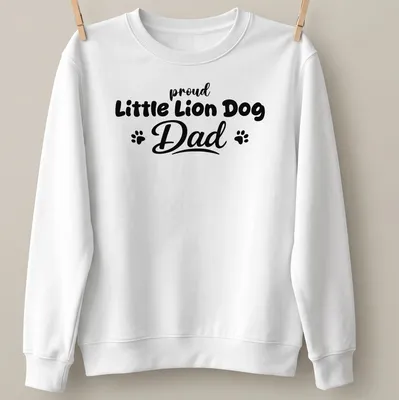 Illustration of a Little Lion Dog with bold text above saying Proud Little Lion Dog Dad — printed on a unisex sweatshirt