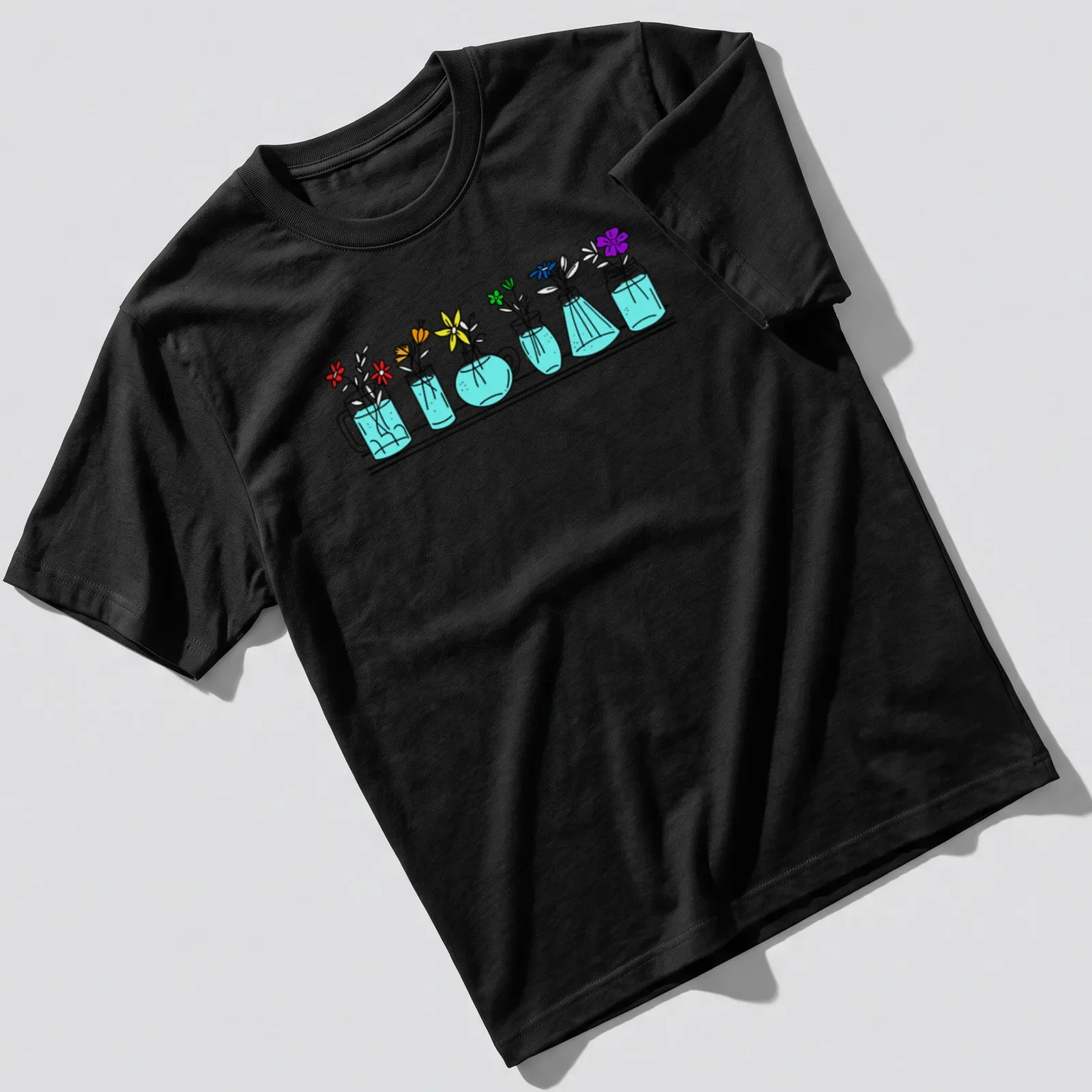 Line-art t-shirt featuring colorful flowers in vases, symbolizing pride and diversity. — printed on a unisex t-shirt