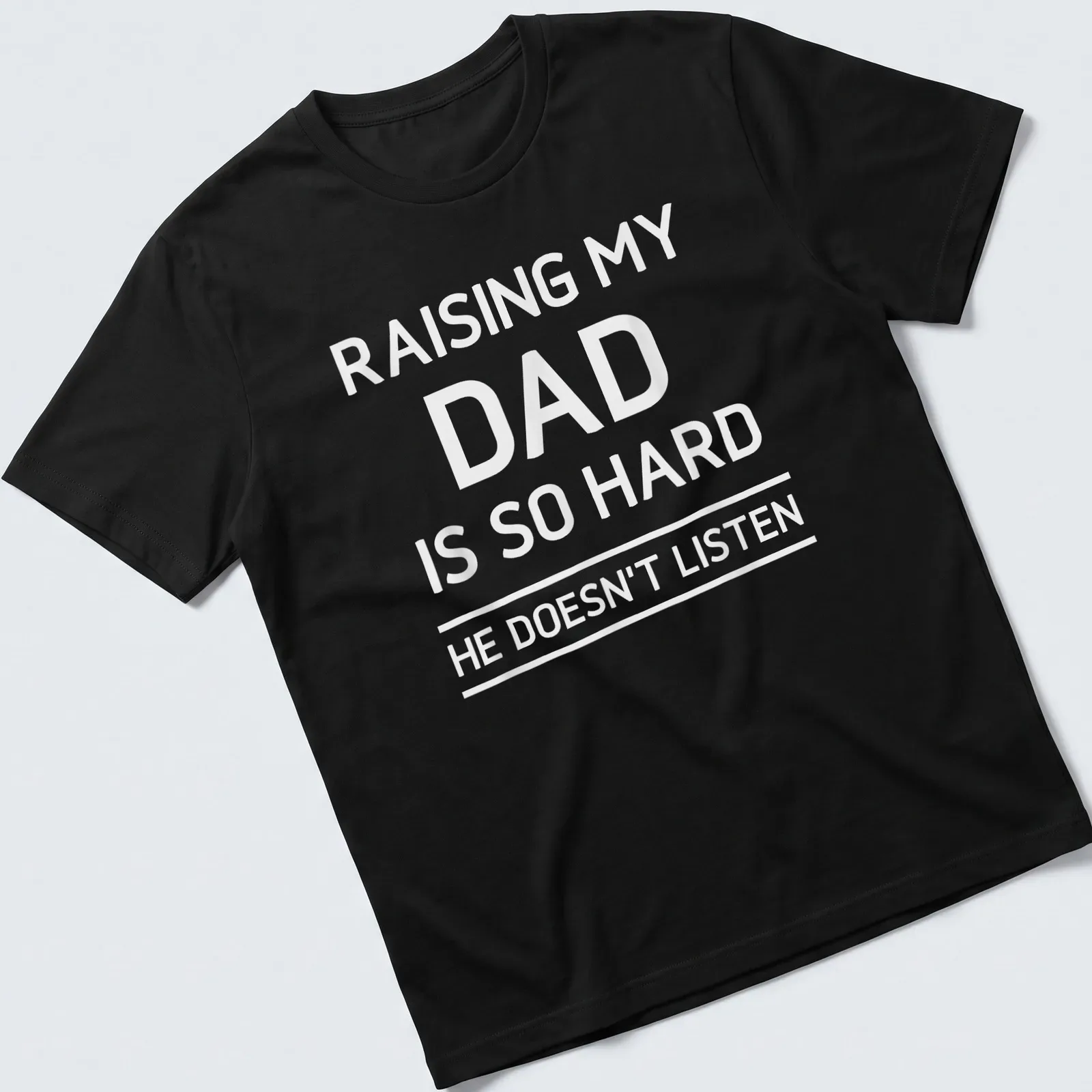 Bold typography humorous T-shirt about raising a dad who doesn't listen — printed on a unisex t-shirt