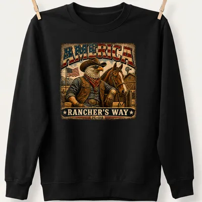 Vintage cowboy eagle design on a tee with rustic text about America — printed on a unisex sweatshirt