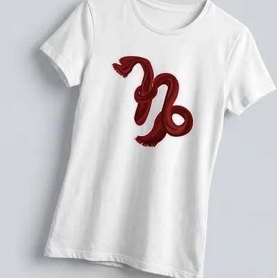 Illustration of the Capricorn symbol created with a red scarf on a — printed on a women's shirt