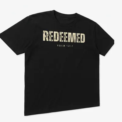 Minimal Christian tee with Redeemed Psalm 107:2 printed in beige and off-white — printed on a unisex t-shirt (angled view)