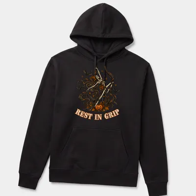 Illustrative t-shirt featuring a skeleton aerialist with Halloween elements in various colors — printed on a unisex hoodie