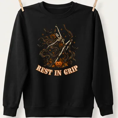 Illustrative t-shirt featuring a skeleton aerialist with Halloween elements in various colors — printed on a unisex sweatshirt