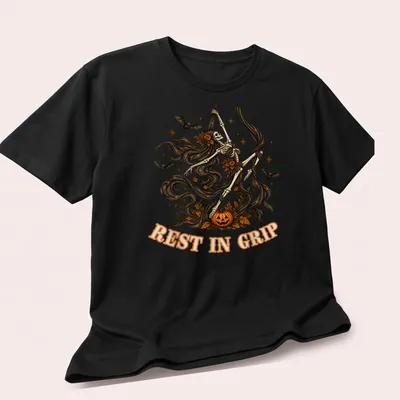 Illustrative t-shirt featuring a skeleton aerialist with Halloween elements in various colors — printed on a unisex t-shirt (angled view)