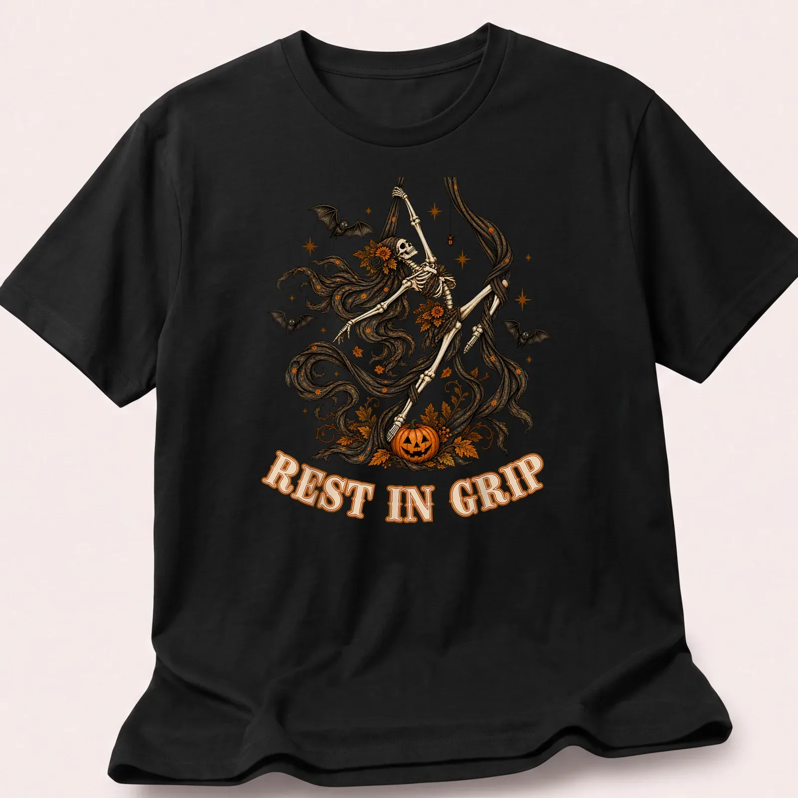 Illustrative t-shirt featuring a skeleton aerialist with Halloween elements in various colors — printed on a unisex t-shirt