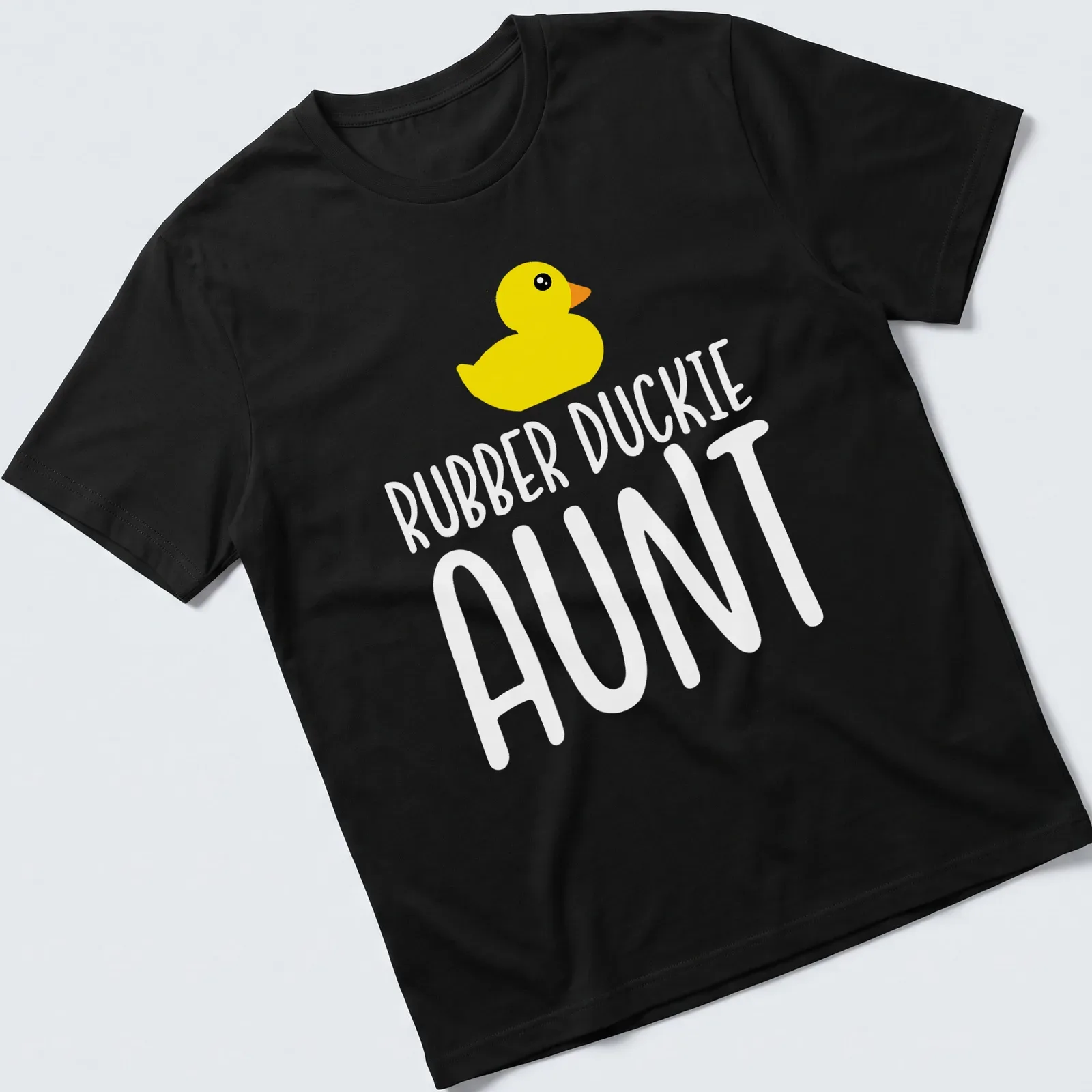 Cute cartoon design of a yellow rubber duck with the text Rubber Duckie Aunt — printed on a unisex t-shirt