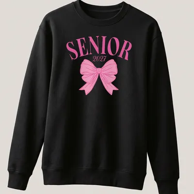 Aesthetic graduation t-shirt with SENIOR 2027 text and a pink bow — printed on a unisex sweatshirt