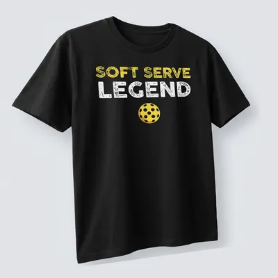 Distressed retro design featuring 'Soft Serve Legend' with a yellow pickleball. — printed on a unisex t-shirt (angled view)