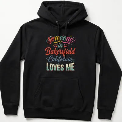 Colorful retro t-shirt with 'someone in Bakersfield California LOVES ME' text — printed on a unisex hoodie