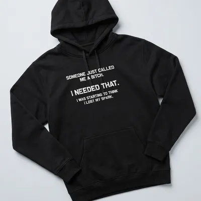 Bold motivational phrase t-shirt with distressed typography in black and white — printed on a unisex hoodie