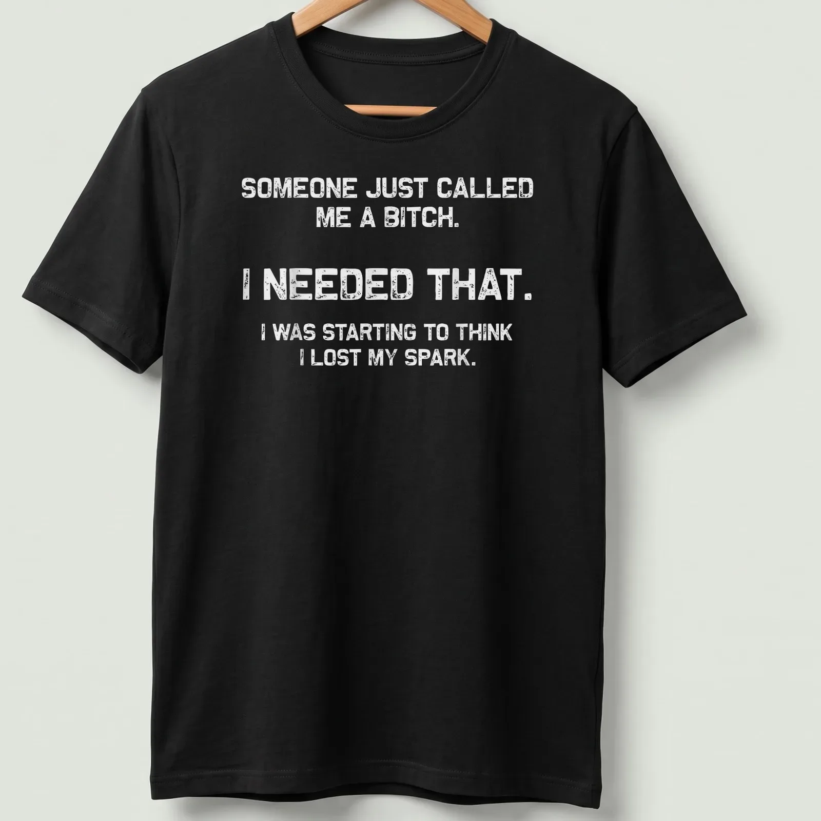 Bold motivational phrase t-shirt with distressed typography in black and white — printed on a unisex t-shirt
