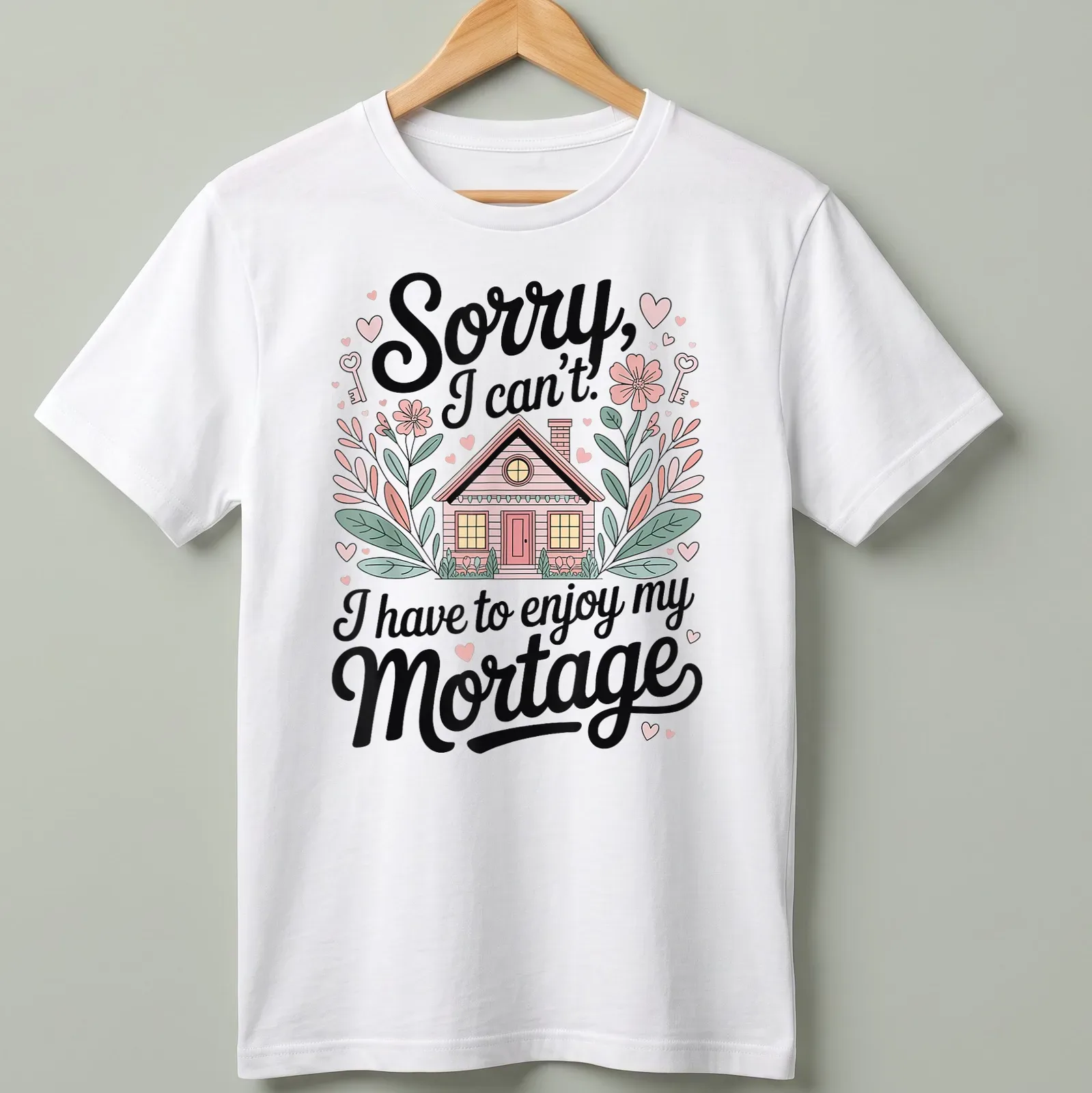 Whimsical house illustration with flowers and hearts and humorous text about mortgages — printed on a unisex t-shirt