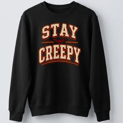 Vintage Halloween tee with a playful bat design and text 'STAY CREEPY' — printed on a unisex sweatshirt