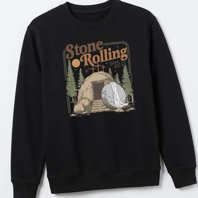 Vintage illustration of an empty tomb with a rolled stone and crosses, featuring the text Stone Rolling Since AD 33 — printed on a unisex sweatshirt