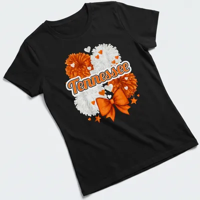 Illustration of an orange bow and pom-poms with Tennessee text — printed on a women's shirt