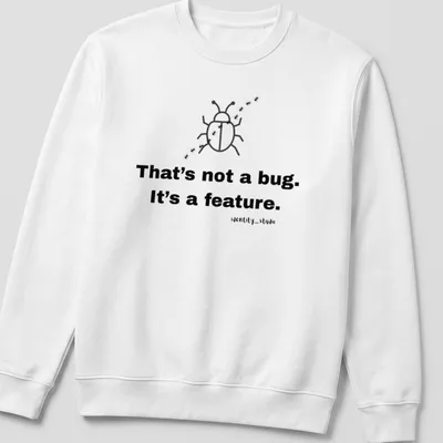 Simple line-art beetle with text 'That's not a bug. It's a feature.' — printed on a unisex sweatshirt