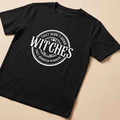 Circular typography shirt with the text about witches and women in white and light beige — printed on a unisex t-shirt